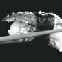 holding sushi with chopsticks isolated on black; Shutterstock ID 117340168; PO: essay